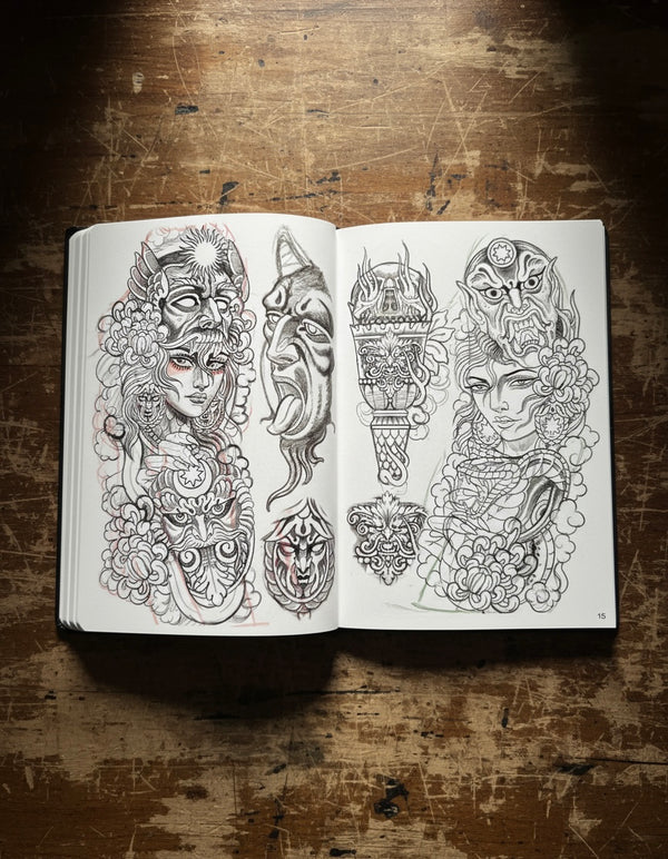 Inside spread of the CHANKEOS Sketchbook featuring expressive tattoo sketches, including skulls, sacred hearts, horned demons, and a full sleeve