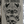 Close-up of the Sketchbook II cover by Toni Donaire, featuring a bold black ink skull illustration with symmetrical elements on a beige background.